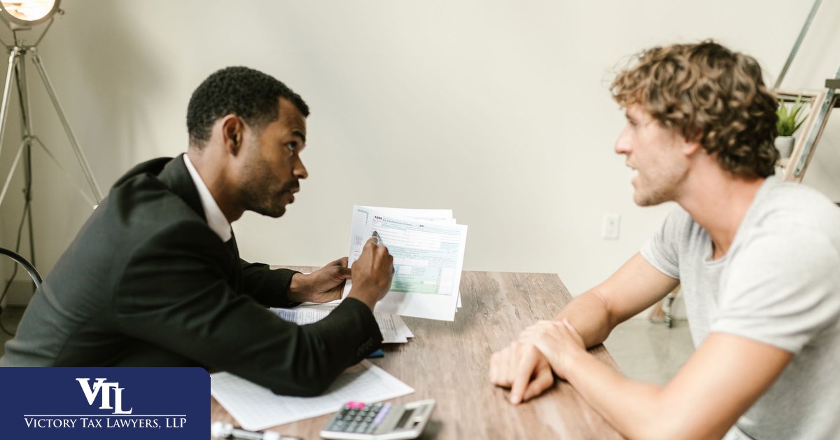 Tax attorney explaining CP14 resolution options to a client