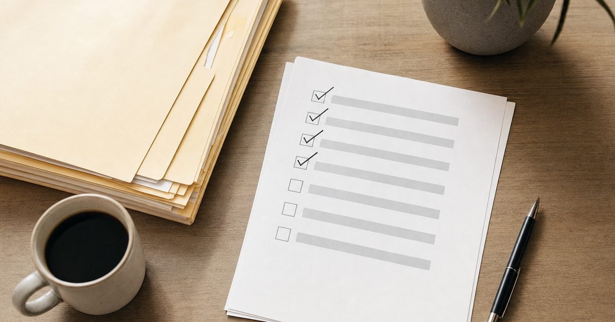 Folders and a partly ticked checklist on a desk representing the levy release steps, Victory Tax Lawyers