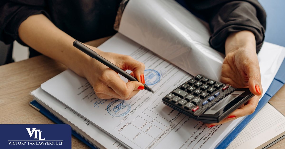 Accountant reviewing sales records and calculations during a CDTFA audit